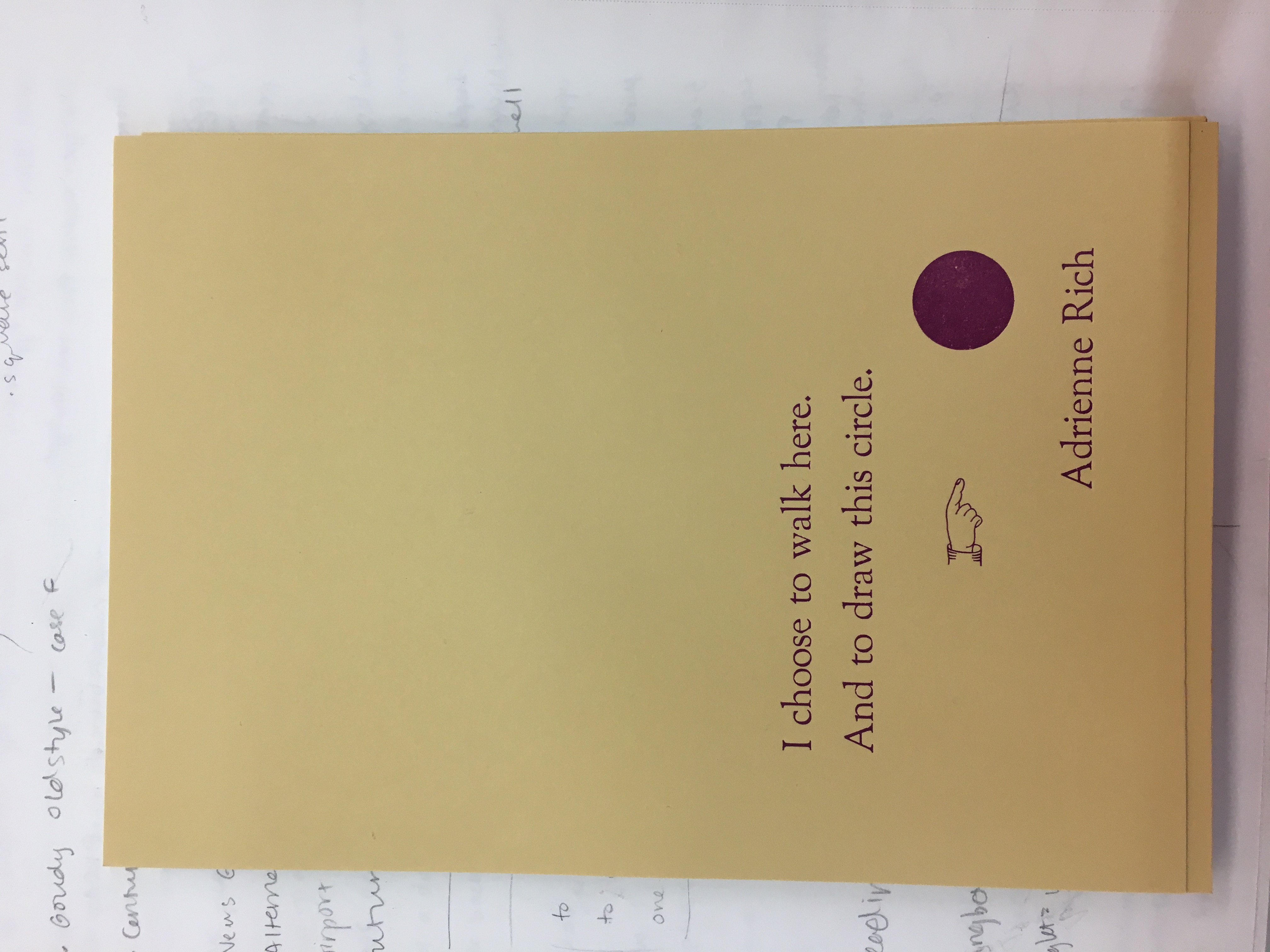 Letterpress print of a quotation by Adrienne Rich: 'I choose to walk here. And to draw this circle.' With illustration of a hand pointing to a dark circle.